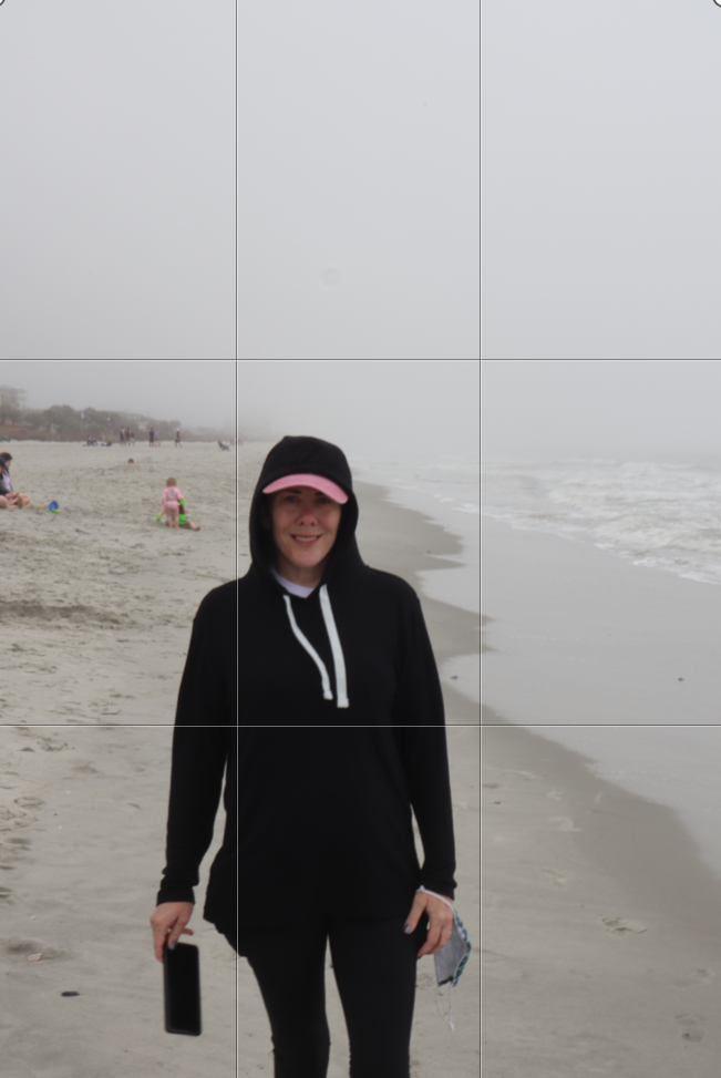 Woman on a beach wearing a hoodie. Not using ROT properly. Showing Grid Lines. 